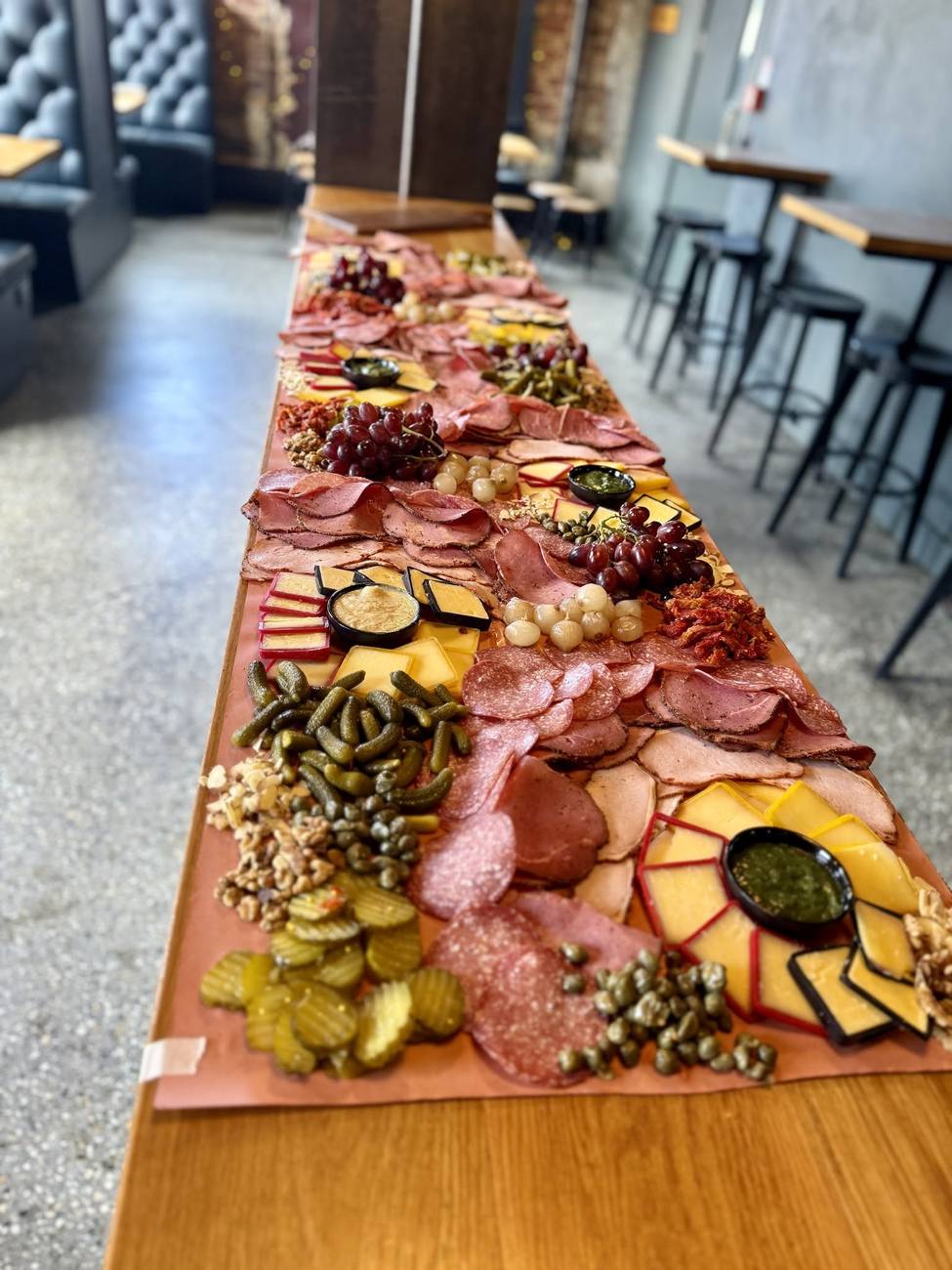 A long grazing table set for a function at Heritage Coffee