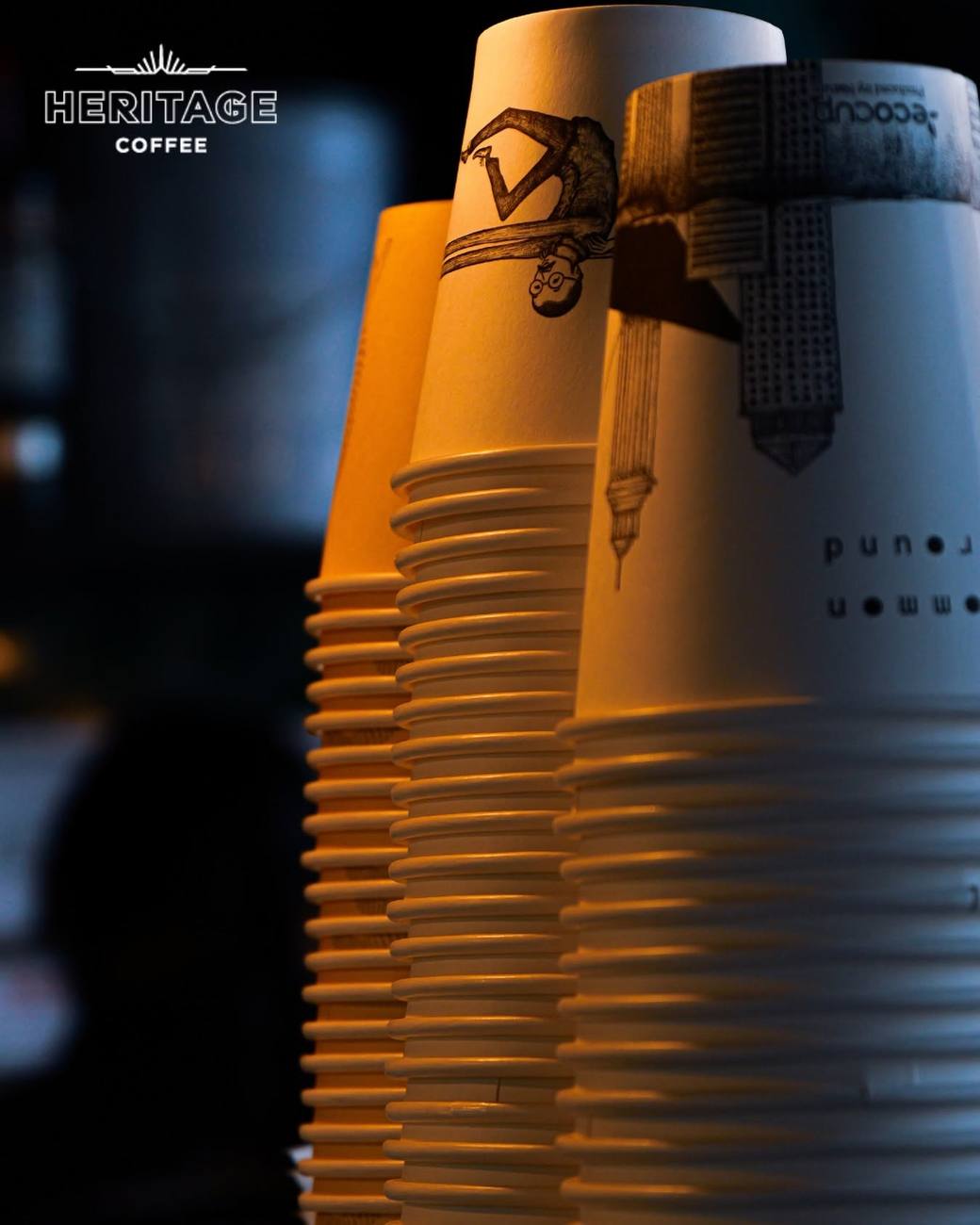Stacks of Heritage Coffee takeaway cups