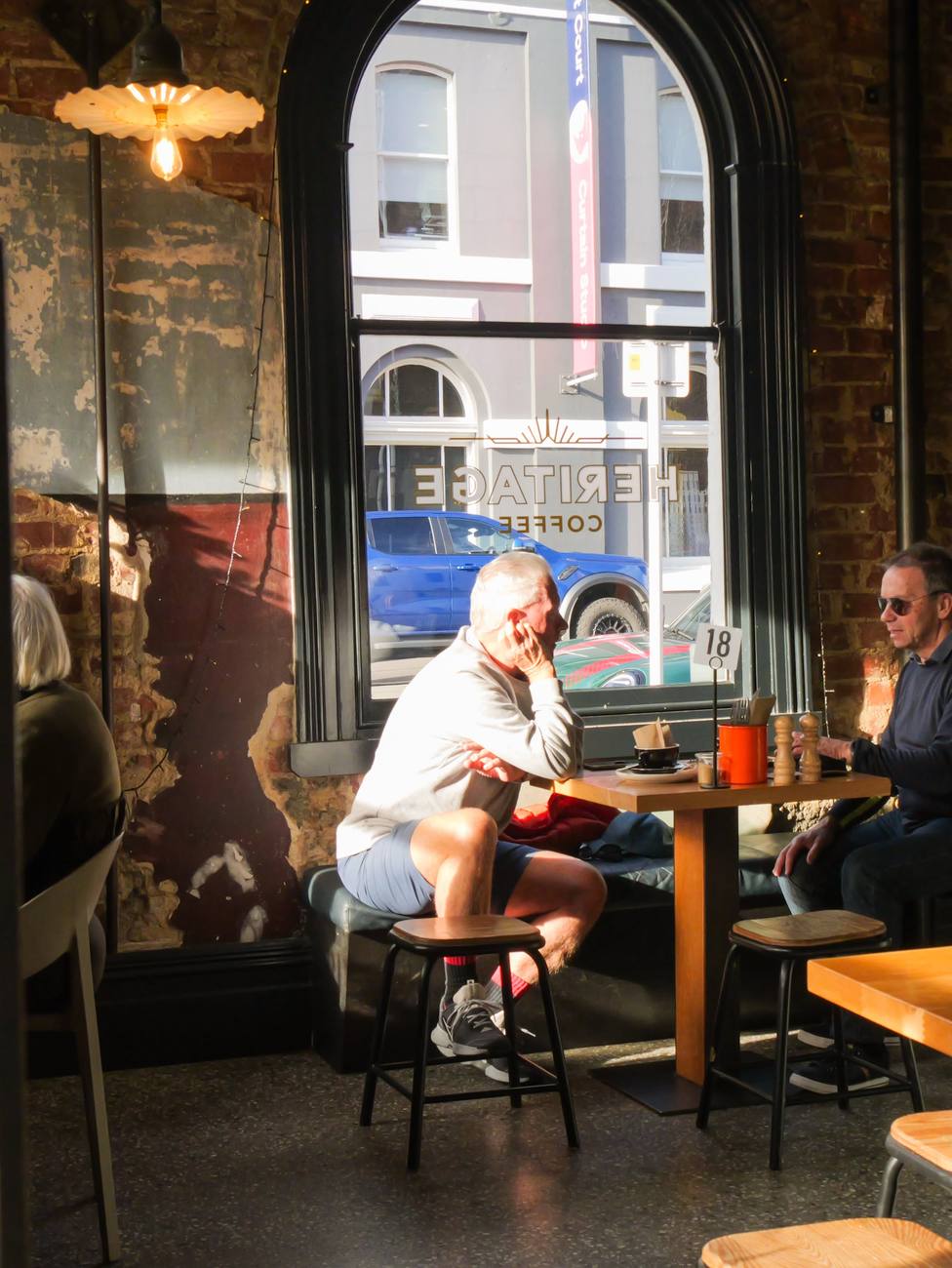 Regulars settled in under an arched window
