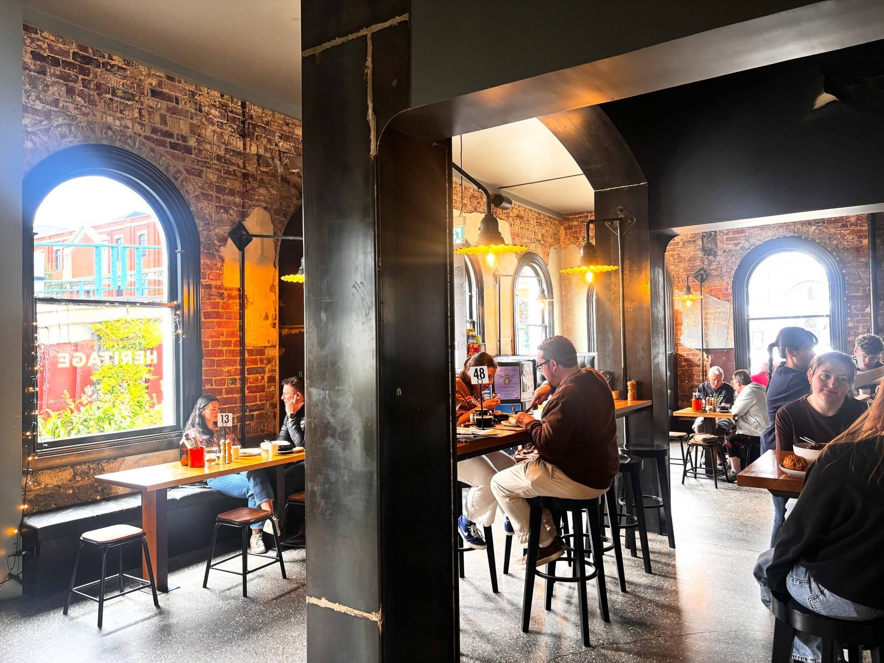 Brick walls and arched windows inside the cafe